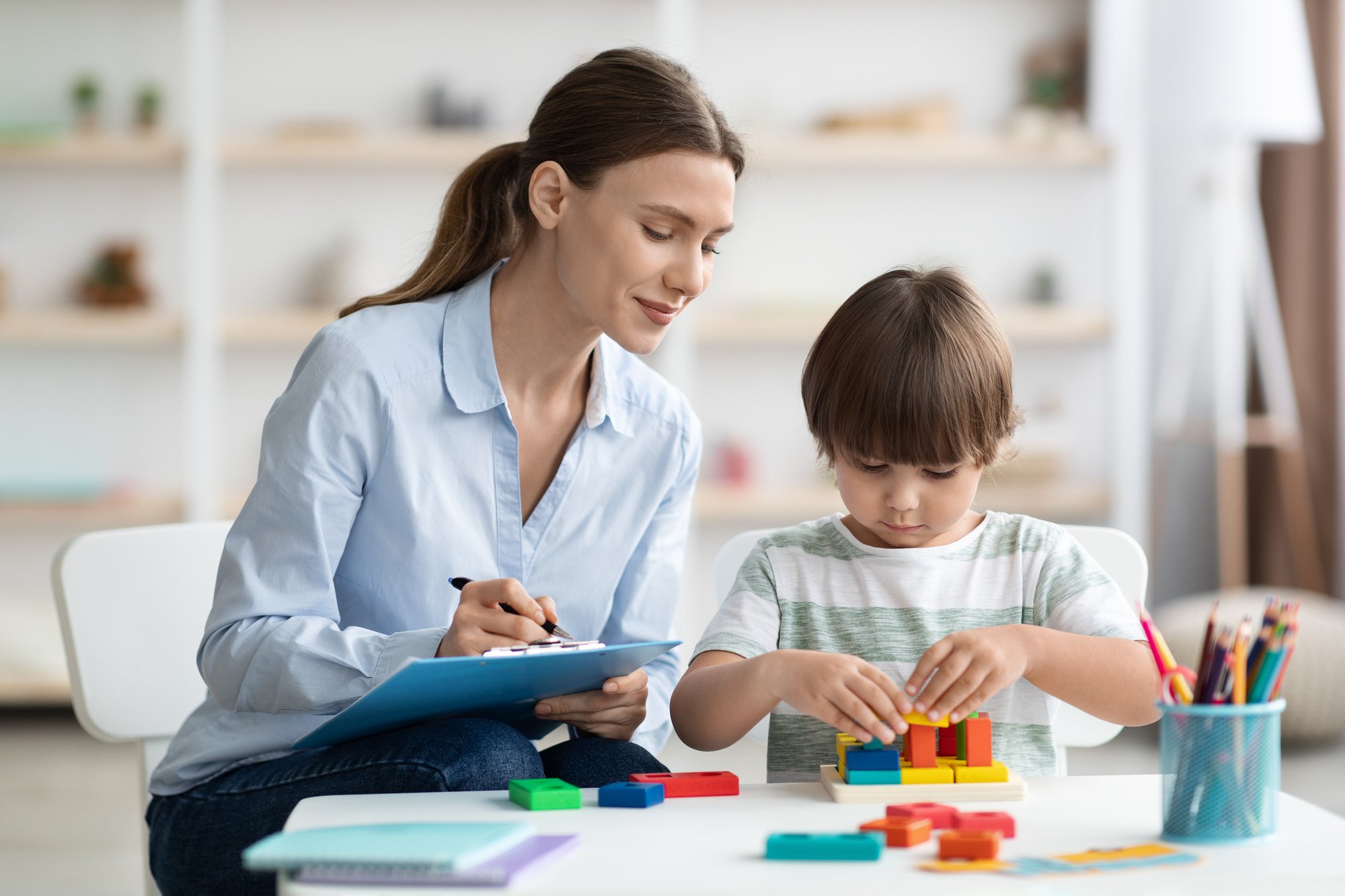 assessment-kids-mental-development-professional-woman-psychologist-watching-little-boy-playing (1)