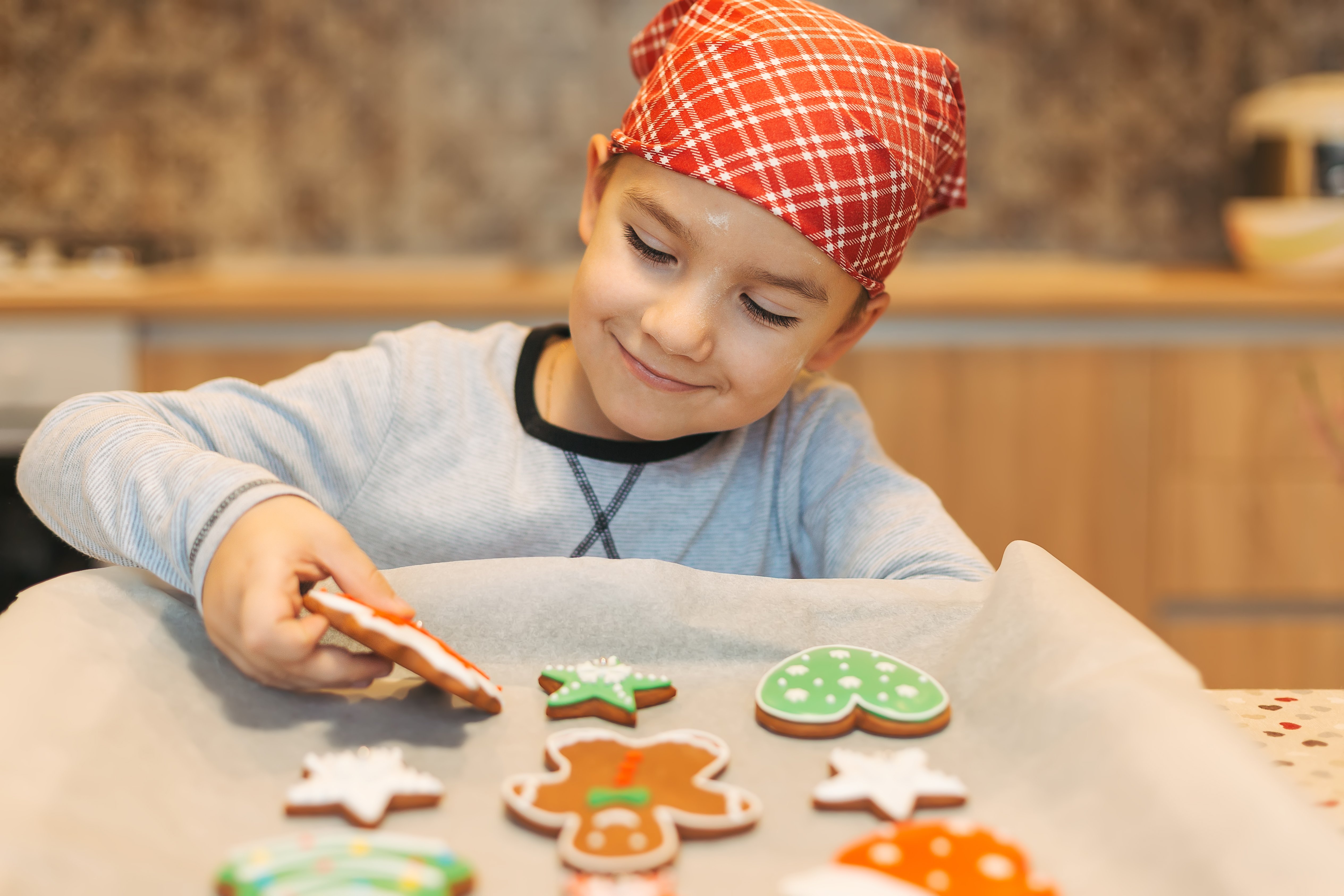 kid-enjoying-christmas-cookies-2023-11-27-05-07-23-utc