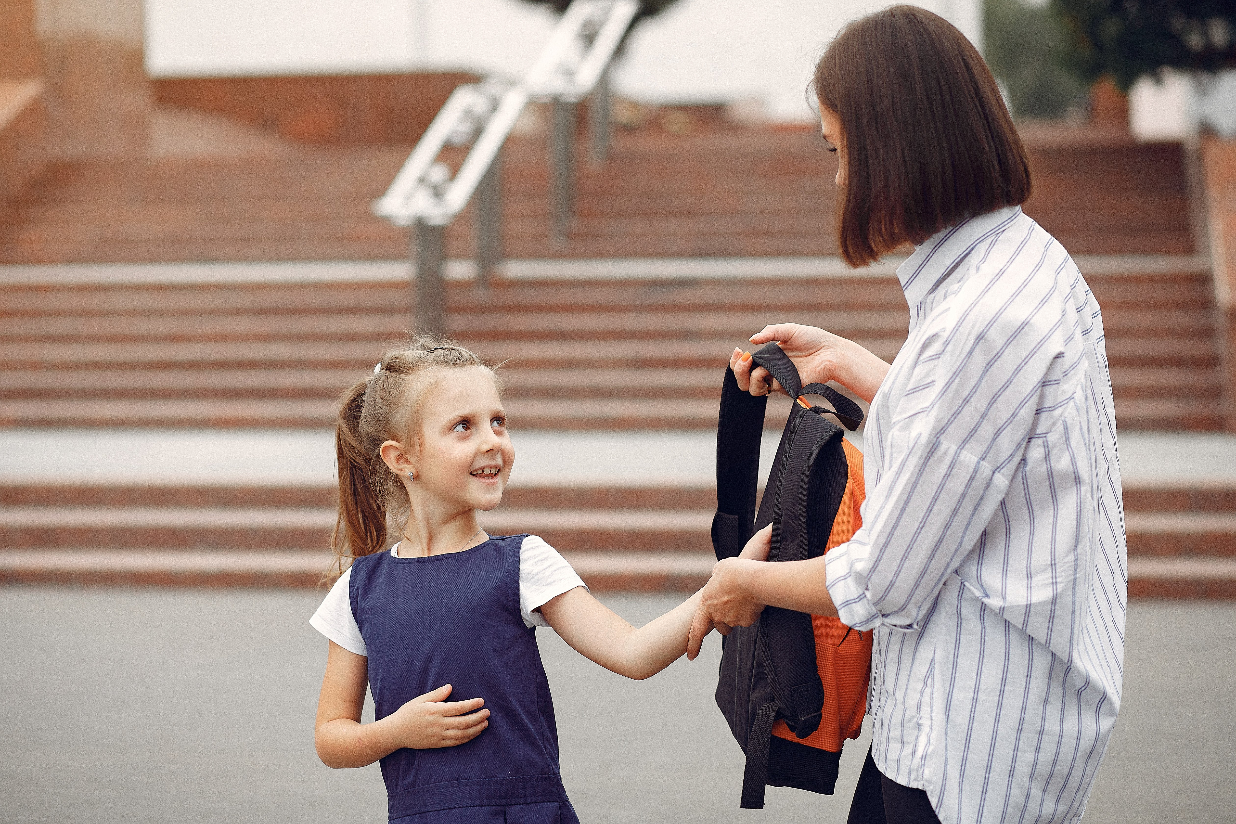 From ABA Therapy to School: Tips for a Successful Transition - Little Girl being picked up at school 